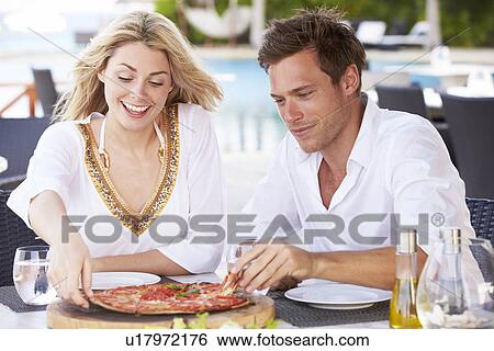 Couple Enjoying Meal In Outdoor Restaurant View Large Photo Image Stock Photograph - Couple Enjoying Meal In Outdoor Restaurant. Fotosearch