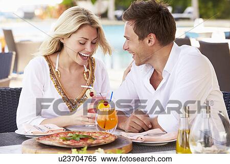 Couple Enjoying Meal In Outdoor Restaurant View Large Photo Image Stock Photography - Couple Enjoying Meal In Outdoor Restaurant. Fotosearch