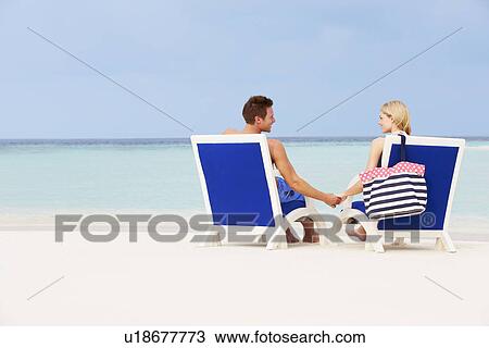Couple On Beach Relaxing In Chairs View Large Photo Image Stock Image - Couple On Beach Relaxing In Chairs. Fotosearch