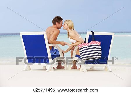 Couple On Beach Relaxing In Chairs View Large Photo Image Stock Photography - Couple On Beach Relaxing In Chairs. Fotosearch