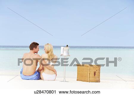 Couple On Beach With Luxury Champagne Picnic View Large Photo Image Stock Image - Couple On Beach With Luxury Champagne Picnic. Fotosearch