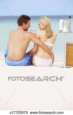 Couple On Beach With Luxury Champagne Picnic View Large Photo Image Stock Photography - Couple On Beach With Luxury Champagne Picnic. Fotosearch