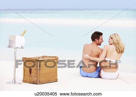 Couple On Beach With Luxury Champagne Picnic View Large Photo Image Stock Photography - Couple On Beach With Luxury Champagne Picnic. Fotosearch