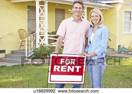 Couple Standing By For Rent Sign Outside Home View Large Photo Image Stock Image - Couple Standing By For Rent Sign Outside Home. Fotosearch