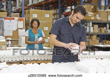 Factory Worker Checking Goods On Production Line View Large Photo Image Stock Photo - Factory Worker Checking Goods On Production Line. Fotosearch