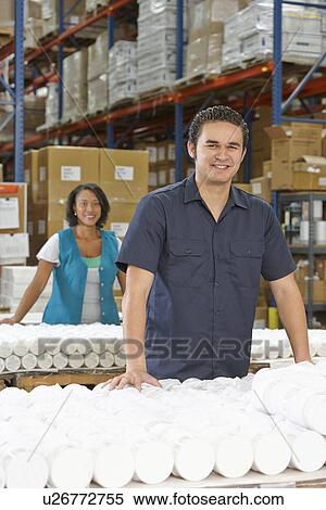 Stock Photography - Factory Worker Checking Goods On Production Line. Fotosearch