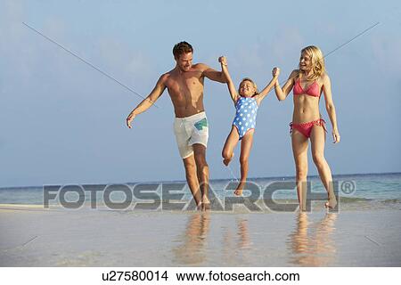 Family Having Fun In Sea On Beach Holiday View Large Photo Image Picture - Family Having Fun In Sea On Beach Holiday. Fotosearch