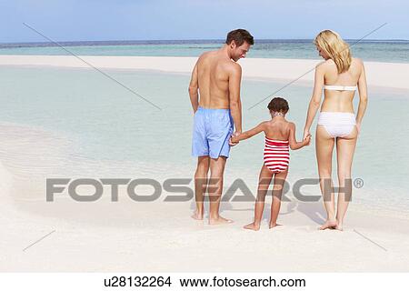 Picture - Family Having Fun In Sea On Beach Holiday. Fotosearch