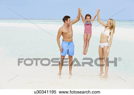 Family Having Fun In Sea On Beach Holiday View Large Photo Image Stock Photography - Family Having Fun In Sea On Beach Holiday. Fotosearch