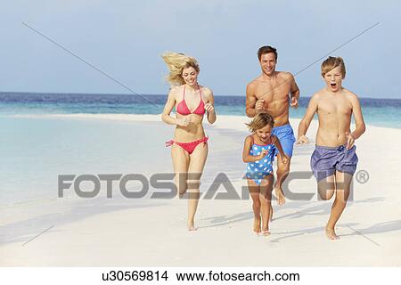 Family Having Fun On Beach Holiday View Large Photo Image Picture - Family Having Fun On Beach Holiday. Fotosearch