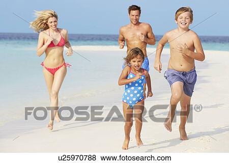 Family Having Fun On Beach Holiday View Large Photo Image Stock Photo - Family Having Fun On Beach Holiday. Fotosearch