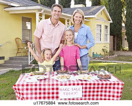 Picture - Family Running Charity Bake Sale. Fotosearch