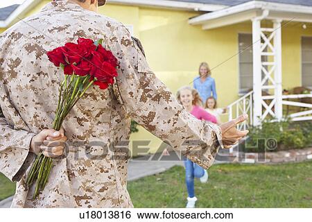 Family Welcoming Husband Home On Army Leave View Large Photo Image Stock Photograph - Family Welcoming Husband Home On Army Leave. Fotosearch
