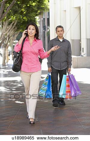 Fed Up Man Carrying Partners Shopping Bags On City Street View Large Photo Image Stock Photography - Fed Up Man Carrying Partners Shopping Bags On City Street. Fotosearch