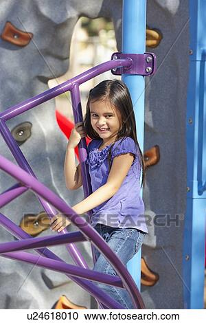Girl On Climbing Frame In Park View Large Photo Image Stock Image - Girl On Climbing Frame In Park. Fotosearch