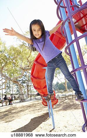 Girl On Climbing Frame In Park View Large Photo Image Stock Photo - Girl On Climbing Frame In Park. Fotosearch