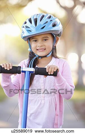 Girl Wearing Safety Helmet Riding Scooter View Large Photo Image Stock Photo - Girl Wearing Safety Helmet Riding Scooter. Fotosearch