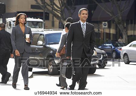 Picture - Group Of Businesspeople Crossing Street. Fotosearch