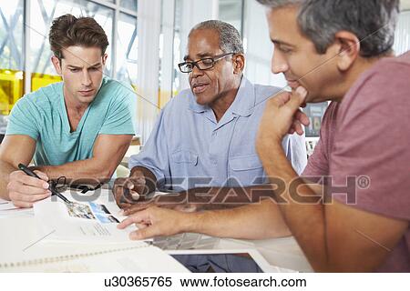 Group Of Men Meeting In Creative Office View Large Photo Image Stock Photography - Group Of Men Meeting In Creative Office. Fotosearch