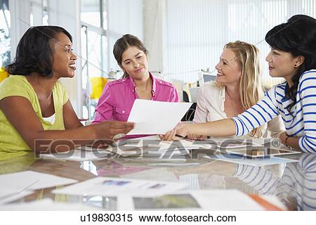 Stock Photography - Group Of Women Meeting In Creative Office. Fotosearch