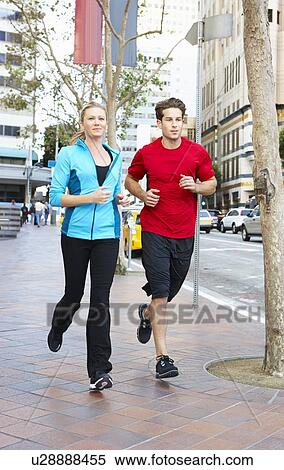 Male And Female Runners On Urban Street View Large Photo Image Stock Photography - Male And Female Runners On Urban Street. Fotosearch