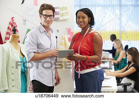 Stock Photo - Man And Woman Meeting In Fashion Design Studio . Fotosearch