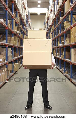 Man Carrying Boxes In Warehouse View Large Photo Image Picture - Man Carrying Boxes In Warehouse . Fotosearch