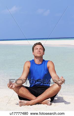 Man Meditating On Beautiful Beach View Large Photo Image Stock Image - Man Meditating On Beautiful Beach. Fotosearch