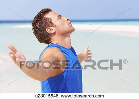 Man Meditating On Beautiful Beach View Large Photo Image Stock Photograph - Man Meditating On Beautiful Beach. Fotosearch