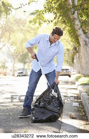 Man Picking Up Litter In Suburban Street View Large Photo Image Stock Image - Man Picking Up Litter In Suburban Street. Fotosearch
