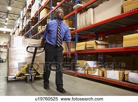 Man Pulling Pallet In Warehouse View Large Photo Image Stock Photography - Man Pulling Pallet In Warehouse. Fotosearch