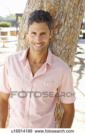 Stock Photo - Man Relaxing In Park. Fotosearch