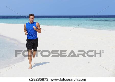 Man Running On Beautiful Beach View Large Photo Image Stock Image - Man Running On Beautiful Beach. Fotosearch