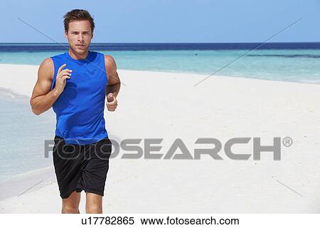 Stock Photography - Man Running On Beautiful Beach. Fotosearch