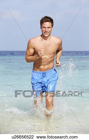 Man Splashing In Beautiful Tropical Sea View Large Photo Image Stock Image - Man Splashing In Beautiful Tropical Sea. Fotosearch