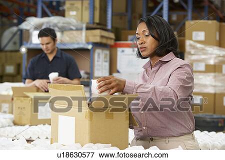 Manager Checking Goods On Production Line View Large Photo Image Stock Photo - Manager Checking Goods On Production Line. Fotosearch