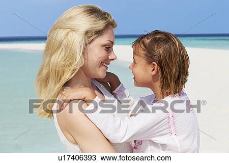 Mother And Daughter Hugging On Beautiful Beach View Large Photo Image Stock Image - Mother And Daughter Hugging On Beautiful Beach . Fotosearch