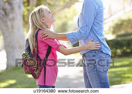 Mother And Daughter Walking To School On Suburban Street View Large Photo Image Stock Image - Mother And Daughter Walking To School On Suburban Street. Fotosearch