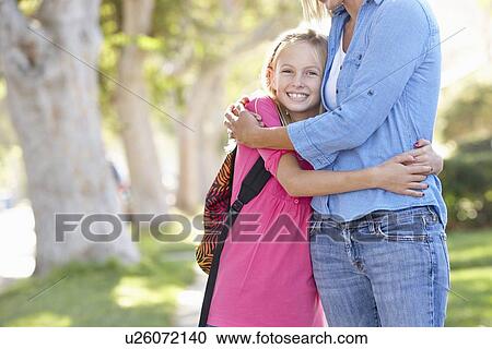 Mother And Daughter Walking To School On Suburban Street View Large Photo Image Stock Image - Mother And Daughter Walking To School On Suburban Street. Fotosearch