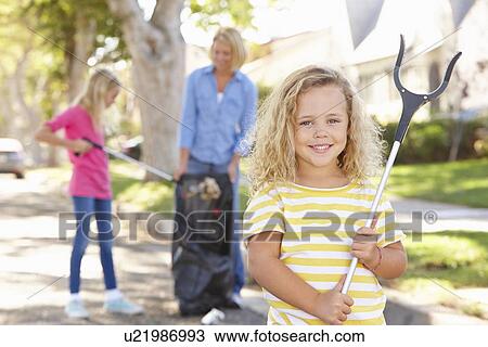 Mother And Daughters Picking Up Litter In Suburban Street View Large Photo Image Stock Image - Mother And Daughters Picking Up Litter In Suburban Street. Fotosearch