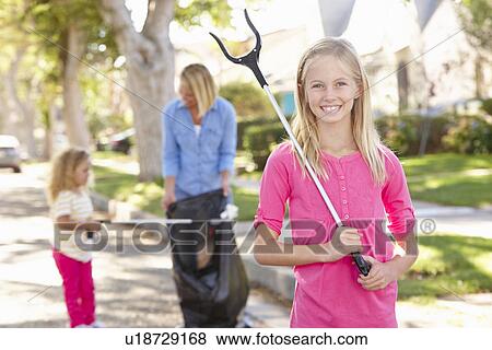 Mother And Daughters Picking Up Litter In Suburban Street View Large Photo Image Stock Photo - Mother And Daughters Picking Up Litter In Suburban Street. Fotosearch