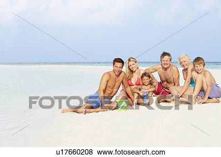 Multi Generation Family Having Fun On Beach Holiday View Large Photo Image Stock Photo - Multi Generation Family Having Fun On Beach Holiday. Fotosearch