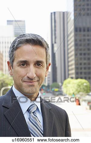 Stock Image - Portrait Of Businessman Outside Office. Fotosearch