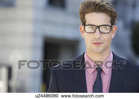 Stock Image - Portrait Of Businessman Outside Office. Fotosearch