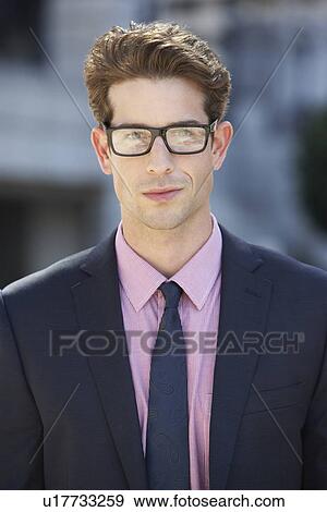 Stock Photo - Portrait Of Businessman Outside Office. Fotosearch