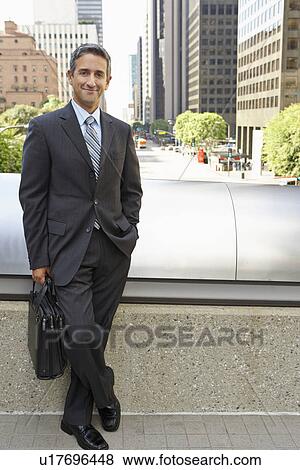 Portrait Of Businessman Standing Outside Office View Large Photo Image Stock Photo - Portrait Of Businessman Standing Outside Office. Fotosearch