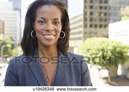 Stock Photo - Portrait Of Businesswoman Outside Office. Fotosearch
