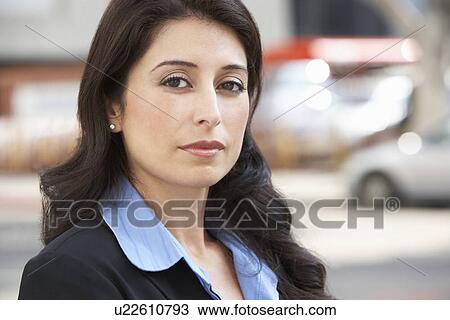 Stock Image - Portrait Of Businesswoman Standing In Street. Fotosearch