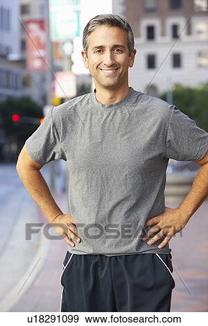 Stock Photo - Portrait Of Male Runner On Urban Street. Fotosearch