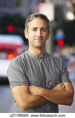 Stock Photography - Portrait Of Male Runner On Urban Street. Fotosearch